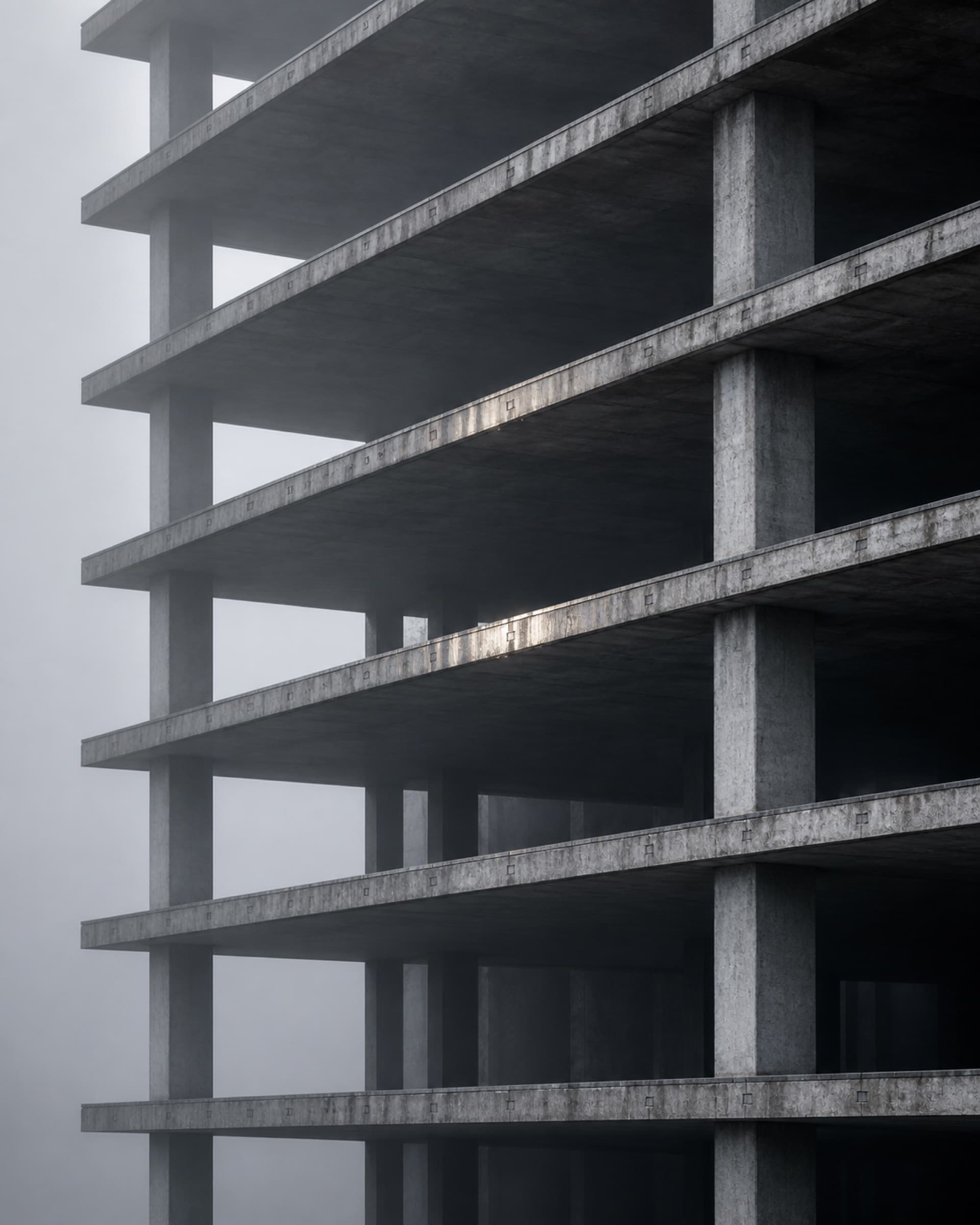 Stacked concrete floor plates of a building under construction.