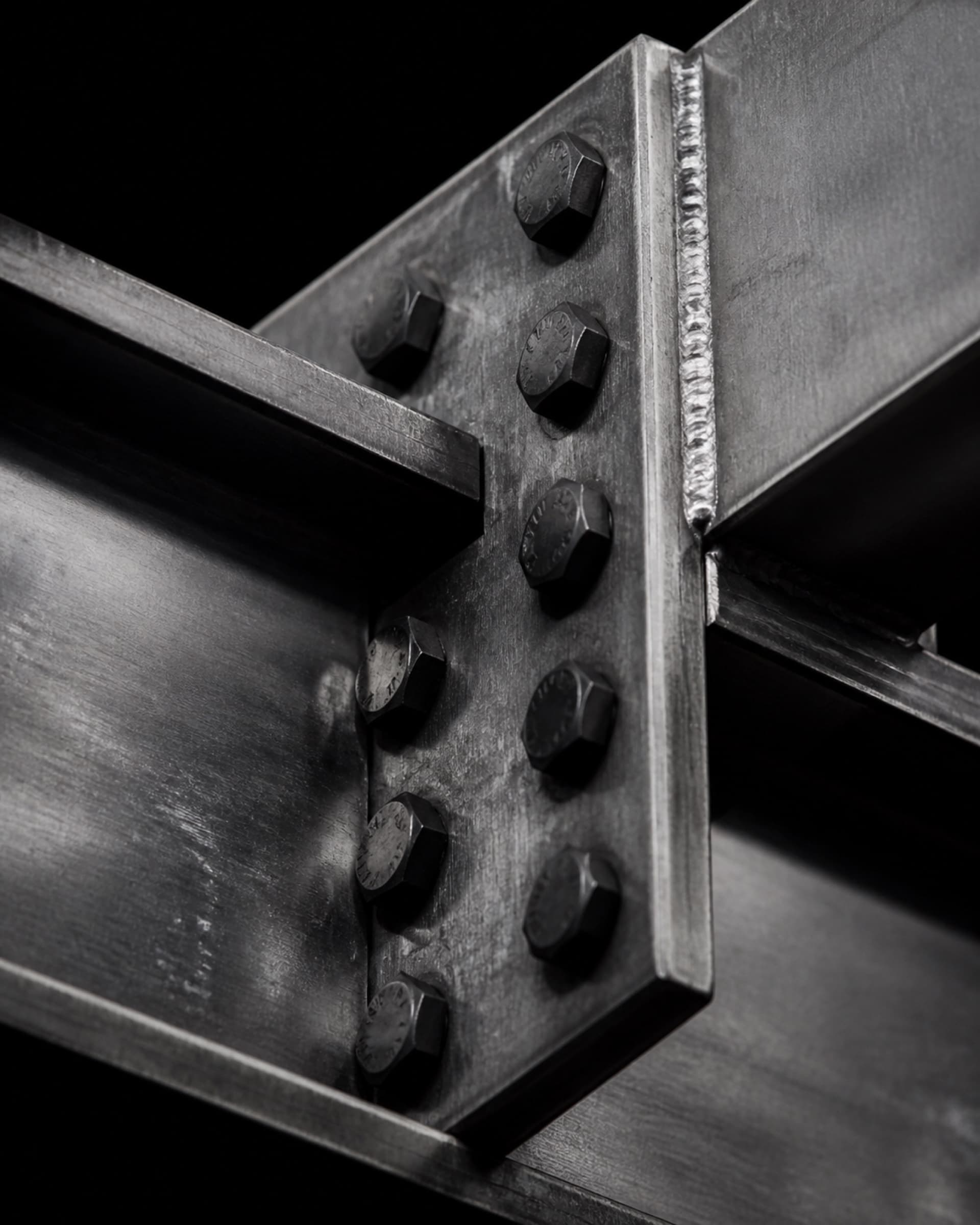 Two structural steel members meeting at a bolted connection.